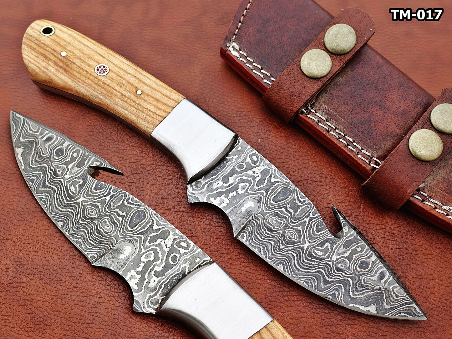 9.5" long Damascus steel Gut hook skinning knife, Full tang Rain drop pattern blade, available in 4 colors, includes Cow hide Leather sheath