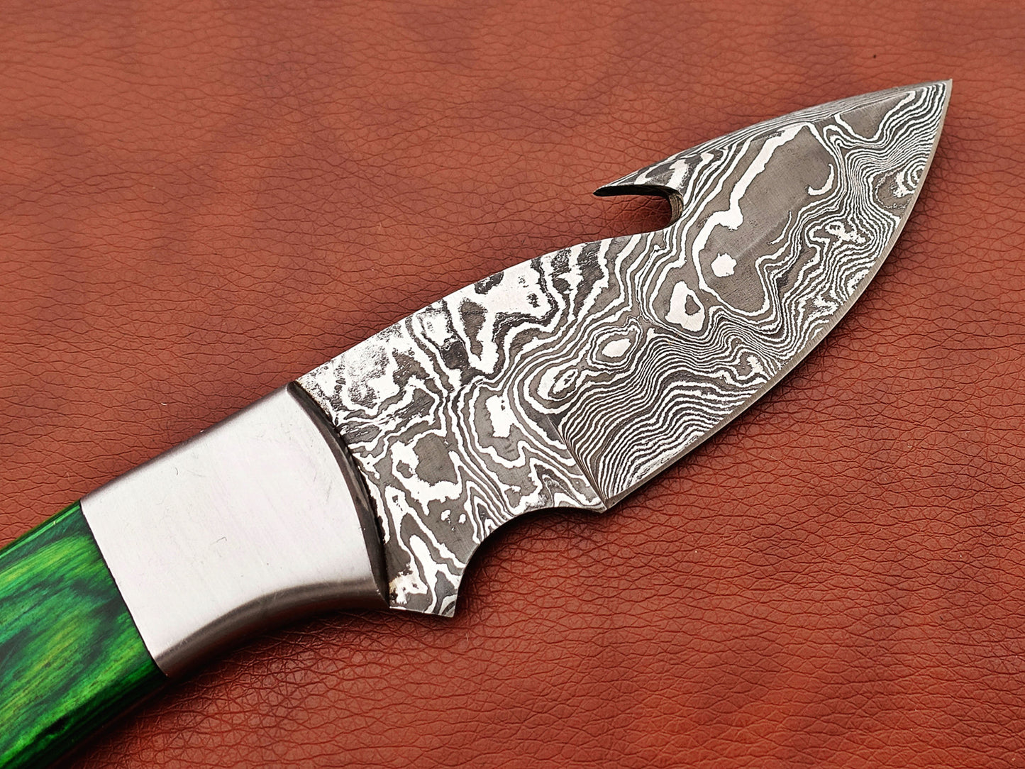 9.5" long Damascus steel Gut hook skinning knife, Full tang Rain drop pattern blade, available in 4 colors, includes Cow hide Leather sheath