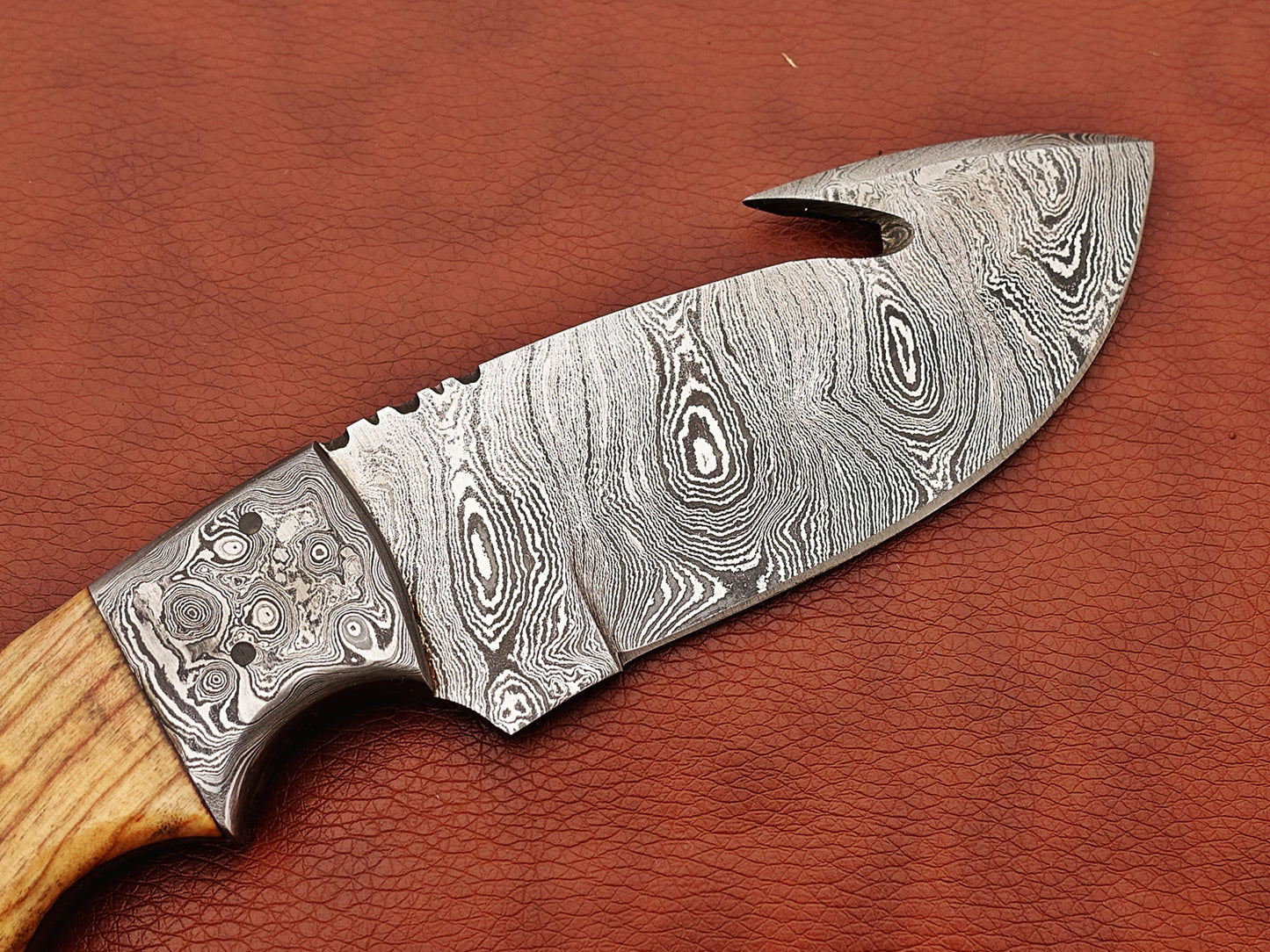 9.5" long Damascus steel Rain drop pattern Gut hook skinning knife, Full tang blade available in 4 colors, includes Cow hide Leather sheath