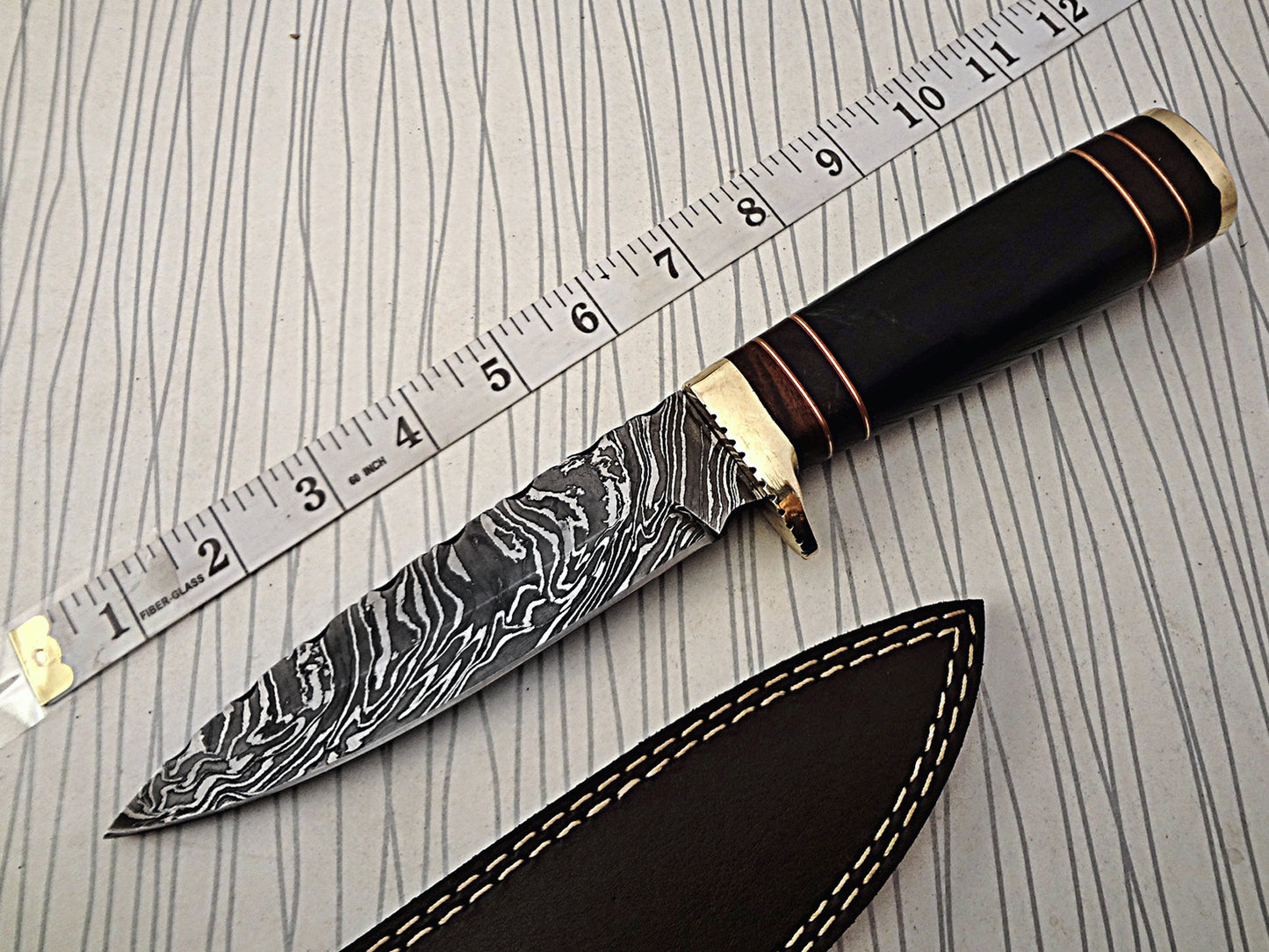 11.5" Long hand forged fire pattern Damascus steel Knife, bull horn with wood & engraved brass scale, thick Cow hide leather sheath