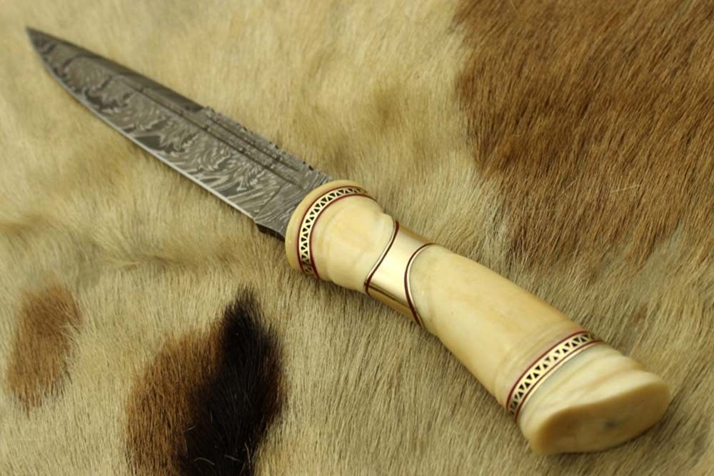 13" carved camel bone W/Brass scale Damascus Steel skinning knife, Cow sheath