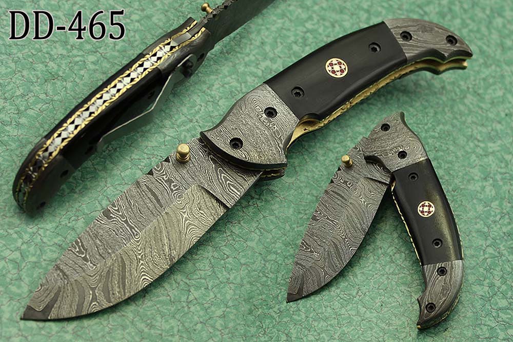 8 Inch Damascus steel folding knife, Available in Bone, Bull horn and Ram scales with Damascus bolster, Equipped with Thumb closing knob and liner lock, Cow hide Leather sheath with belt loop