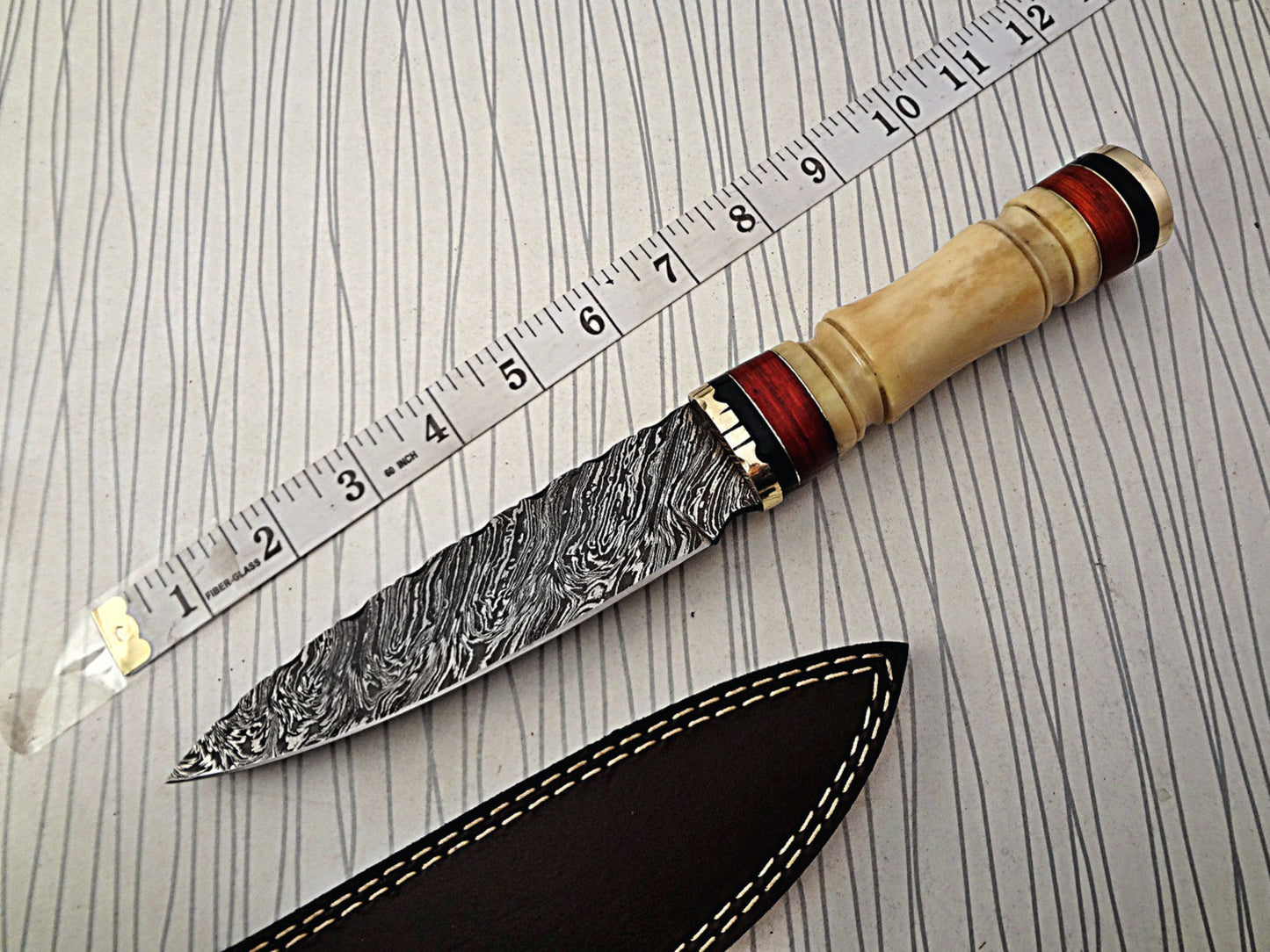 11" Long Damascus steel hunting Knife hand forged fire pattern, engraved Camel bone & brass round scale, thick Cow hide leather sheath