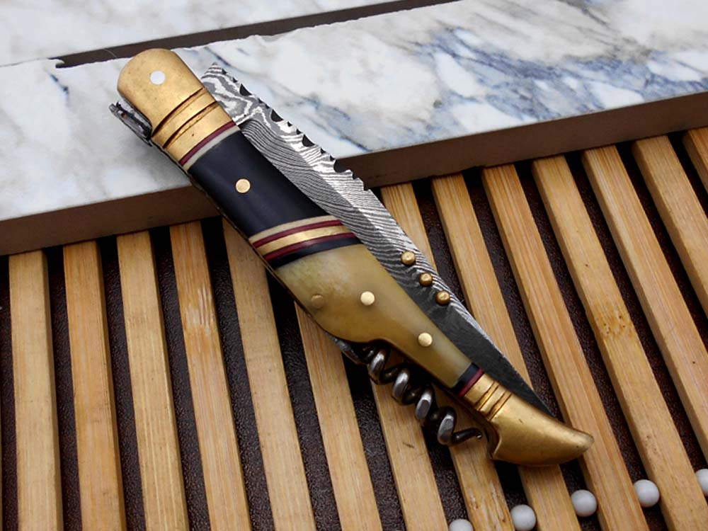 8 Inches long Damascus steel Hand Forged Folding Knife W/wine opener, Bull horn camel bone & brass scale, Cowleather sheath With loop